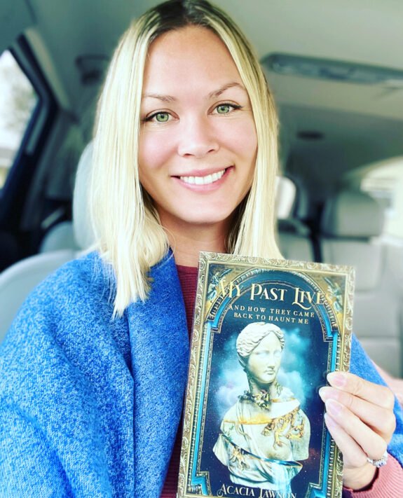 acacia lawson hold her book